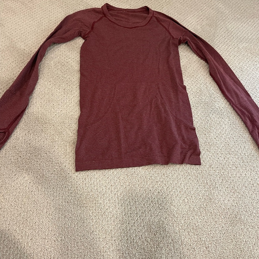 Super cute long sleeve lululemon shirt size 4 red striped in perfect condition!